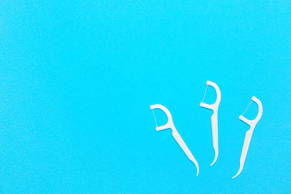 Floss Toothpicks Blue Background — 图库照片