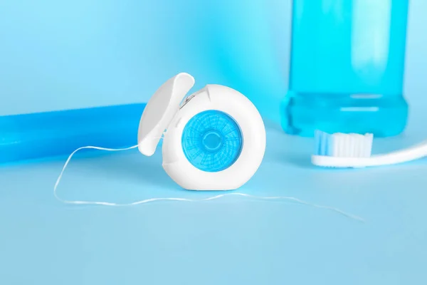 Dental Floss Toothbrush Blue Background — Stock Photo, Image