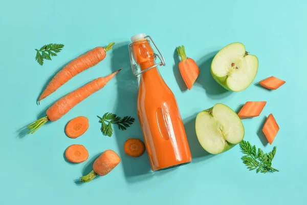 Glass Bottle Tasty Carrot Juice Blue Background — Stock Photo, Image