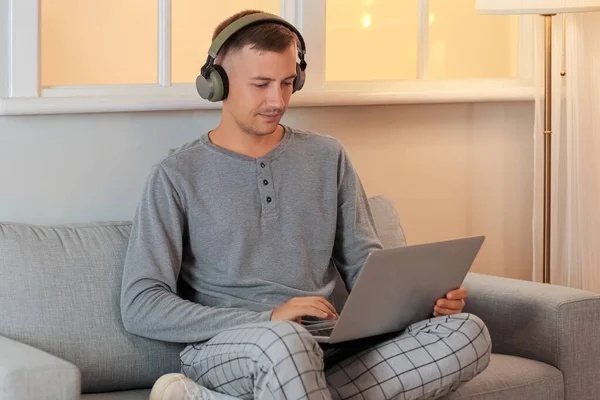 Young Man Headphones Laptop Studying Online Home Late Evening — Stock Photo, Image