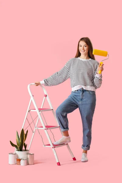 Young Woman Roller Ladder Paint Cans Houseplant Pink Background — Stock Photo, Image