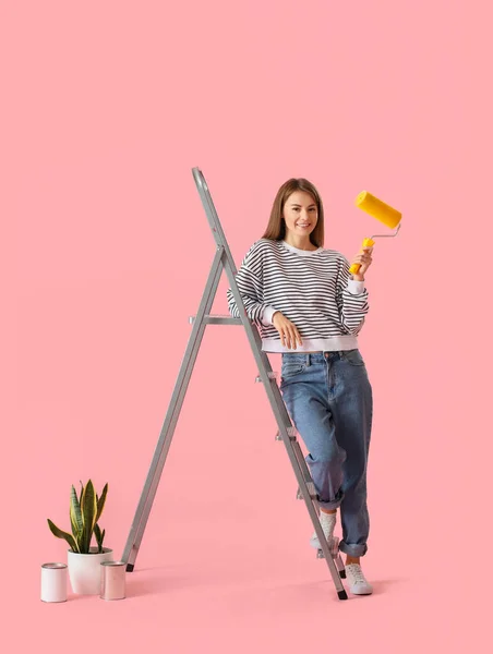 Young Woman Roller Ladder Paint Cans Houseplant Pink Background — Fotografia de Stock