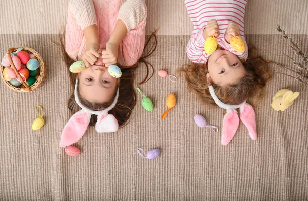 Little Girls Bunny Ears Easter Eggs Lying Home Top View — Stock Photo, Image