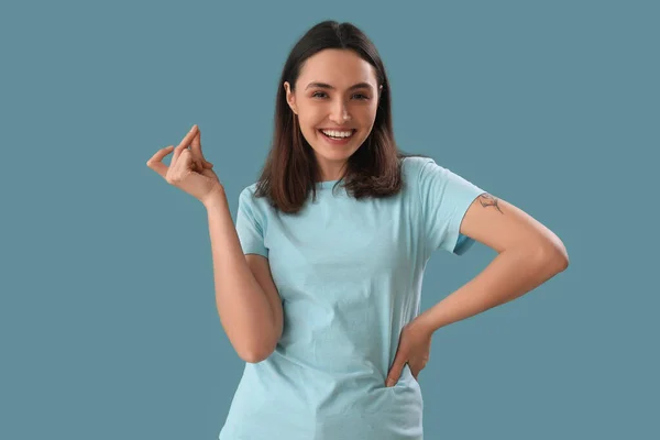 Young Woman Snapping Fingers Blue Background — Stock Photo, Image