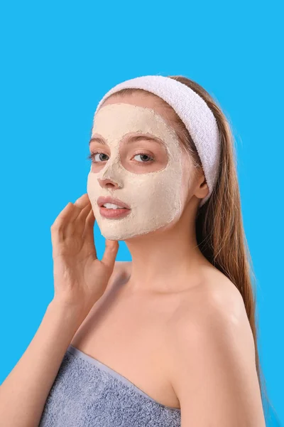 Young Woman Applied Turmeric Mask Blue Background Closeup — Stockfoto