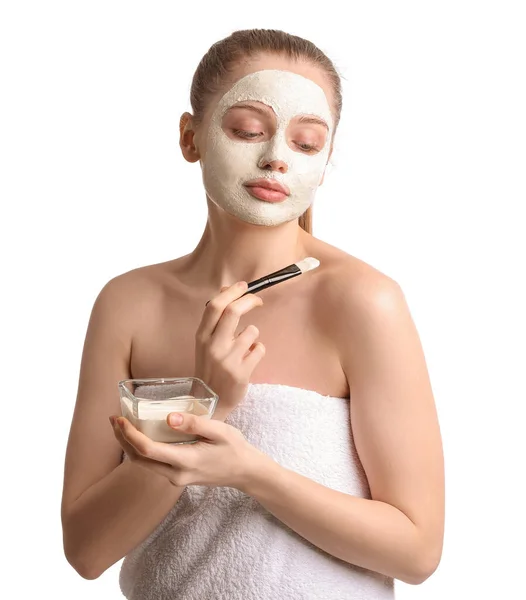 Young Woman Applying Turmeric Mask Brush White Background —  Fotos de Stock