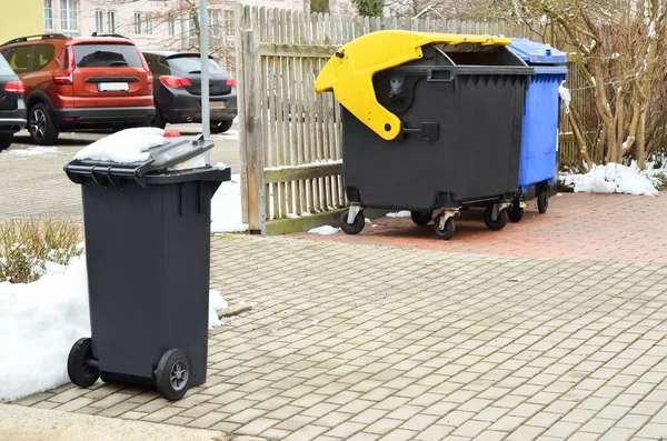 stock image View of garbage containers in city on winter day