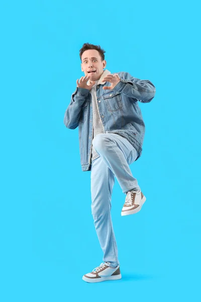 stock image Scared young man on light blue background