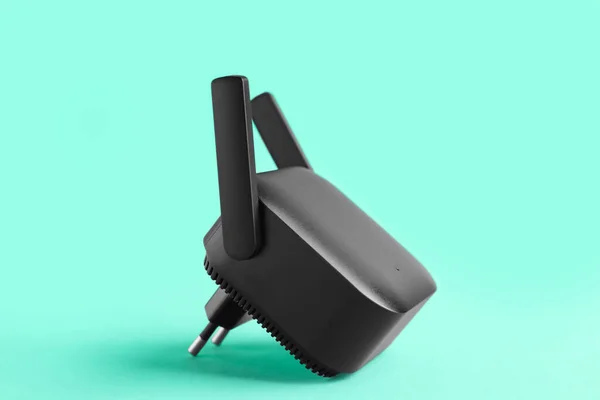 Black Wifi Repeater Turquoise Background — Stock Photo, Image