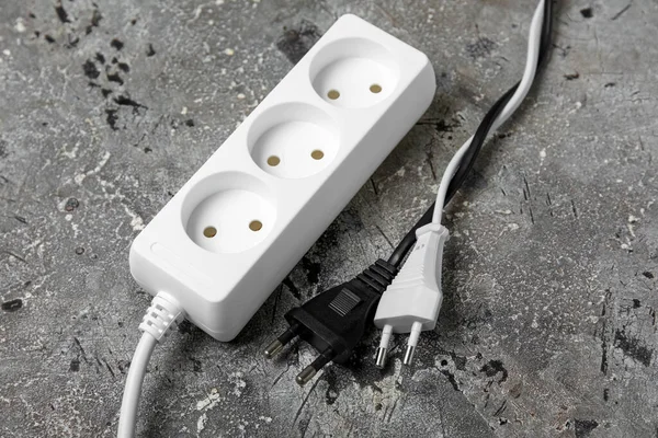 Electric Extension Cord Plugs Grey Grunge Background — Stock Photo, Image