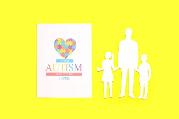 Card for World Autism Awareness Day and family figure on yellow background