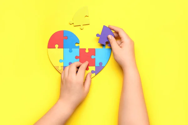 Child Autistic Disorder Doing Puzzle Yellow Background — Stock Photo, Image