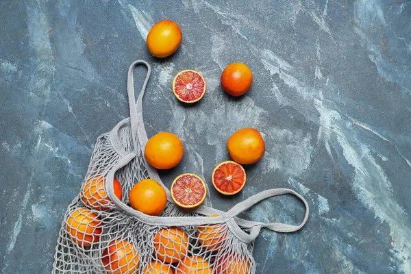 Mesh Bag Tasty Blood Oranges Blue Grunge Background — Stock Photo, Image