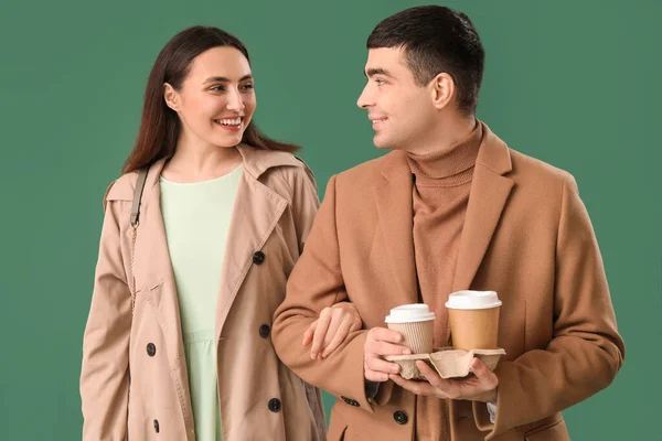 Lovely Young Couple Cups Coffee Green Background — Stock Photo, Image