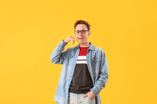Cool Young Man Showing Call Gesture Yellow Background — Stockfoto