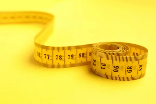 New Measuring Tape Yellow Background Closeup — Stock Photo, Image