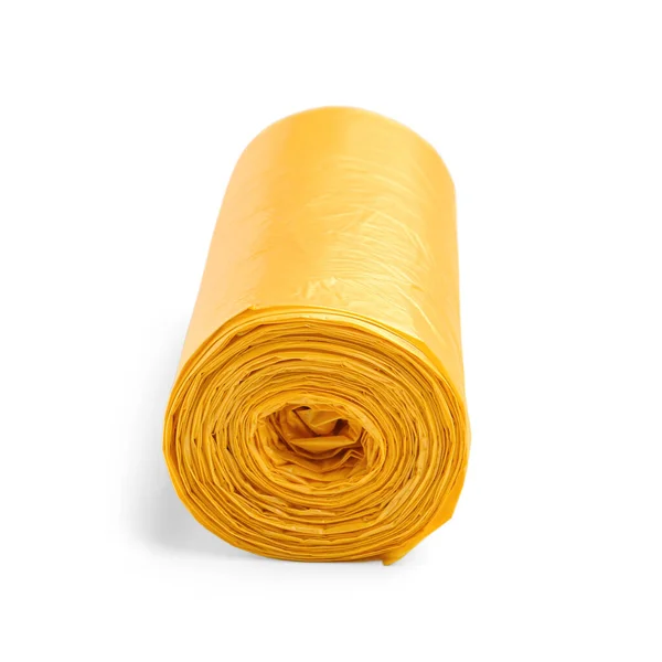 白い背景に隔離されたゴミ袋の黄色のロール — ストック写真