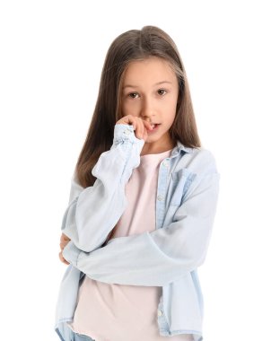 Little girl biting nails on white background