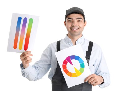 Male painter with color palettes on white background