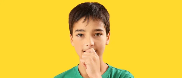 Little Boy Biting Nails Yellow Background — Stock Fotó