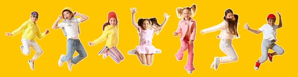 Sarı Arka Planda Zıplayan Bir Grup Küçük Çocuk — Stok fotoğraf