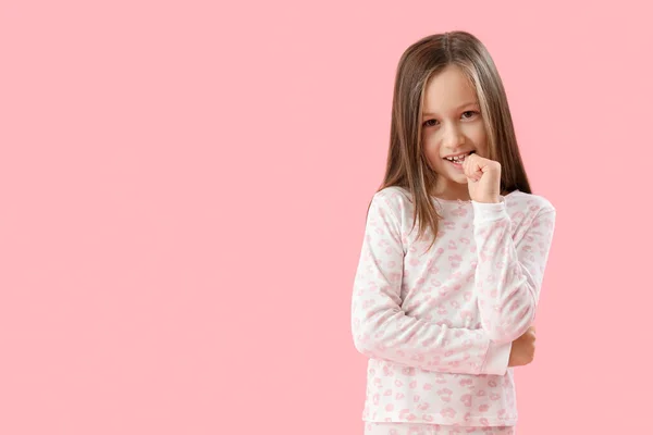 Little Girl Biting Nails Pink Background — Zdjęcie stockowe