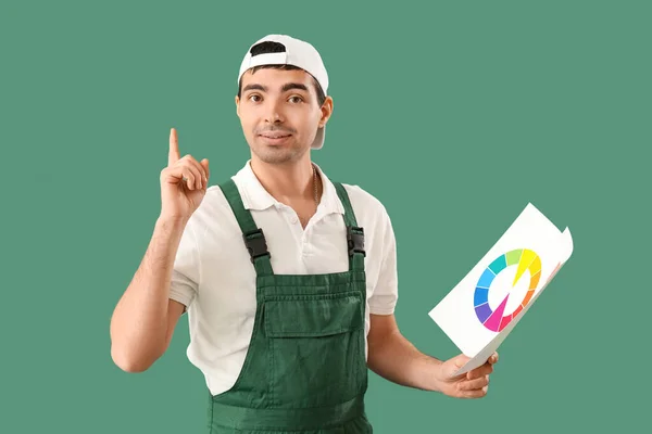 Male Painter Color Palettes Pointing Something Green Background — Stock Photo, Image