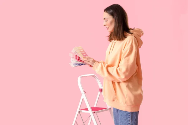 Young Woman Paint Palettes Ladder Pink Background — Stockfoto