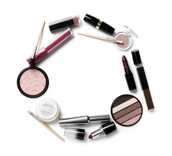 Frame made of decorative cosmetics isolated on white background