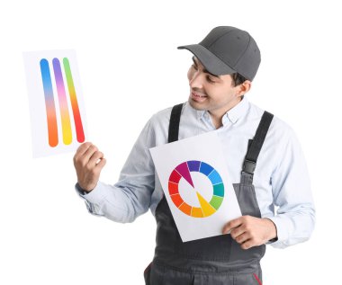Male painter with color palettes on white background