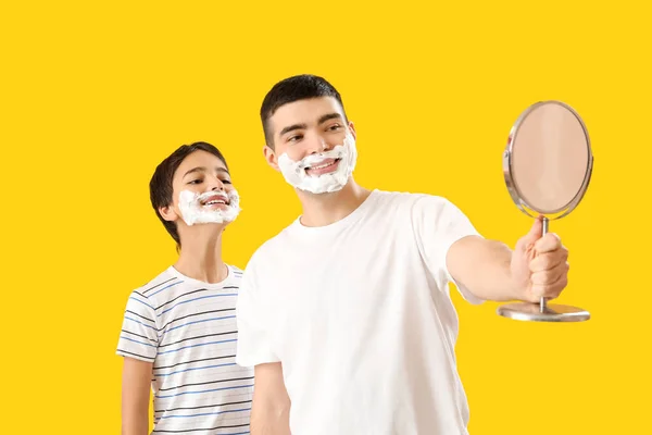 Man His Little Son Shaving Foam Faces Looking Mirror Yellow — Stock Photo, Image