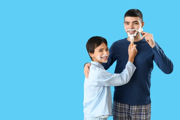 Man His Little Son Applying Shaving Foam Faces Blue Background — Stock Photo, Image