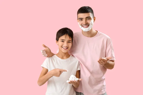 Man His Little Son Applying Shaving Foam Faces Pink Background — Stock Photo, Image