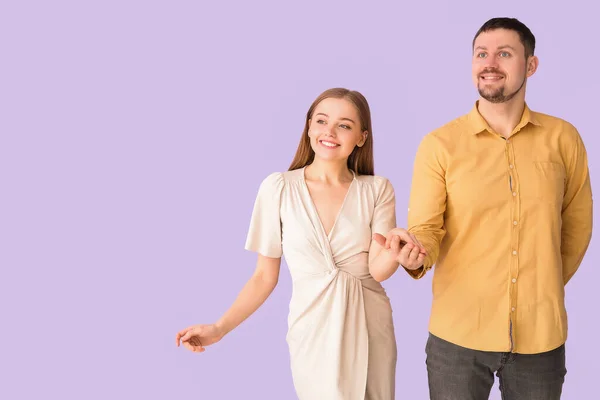 Lovely Young Couple Walking Hand Hand Lilac Background — Stock Photo, Image