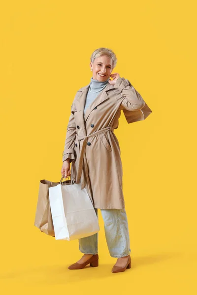 Beautiful Mature Woman Shopping Bags Yellow Background — Stock Photo, Image