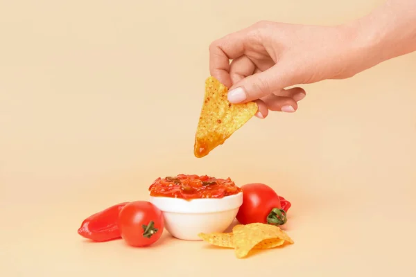 Woman Dipping Nacho Tasty Salsa Sauce Color Background — Stock Photo, Image