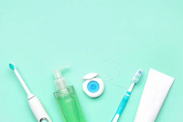 Set for oral hygiene on turquoise background