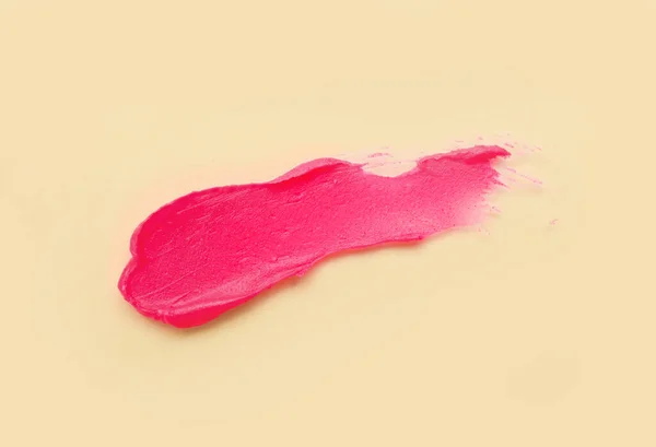米色背景上的粉红唇膏笔迹 — 图库照片