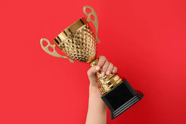 Woman Gold Cup Red Background — Stock Photo, Image