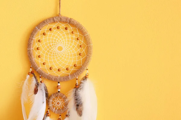 stock image Dream catcher hanging on yellow wall