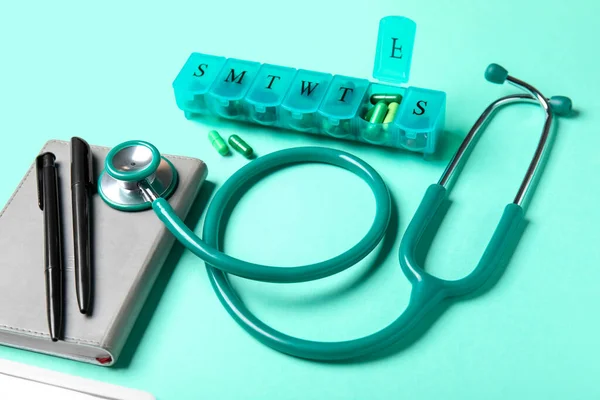Stethoscope Notebook Pills Organizer Turquoise Background — Stock Photo, Image