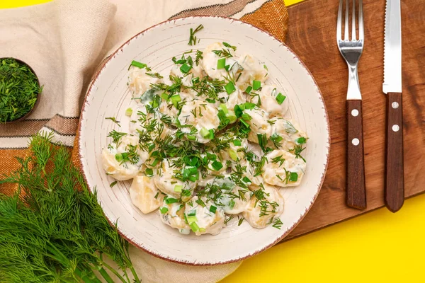 Plate Tasty Potato Salad Greens Yellow Background — Stock Photo, Image