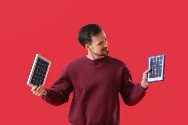 Handsome Man Portable Solar Panels Red Background — Stock Photo, Image