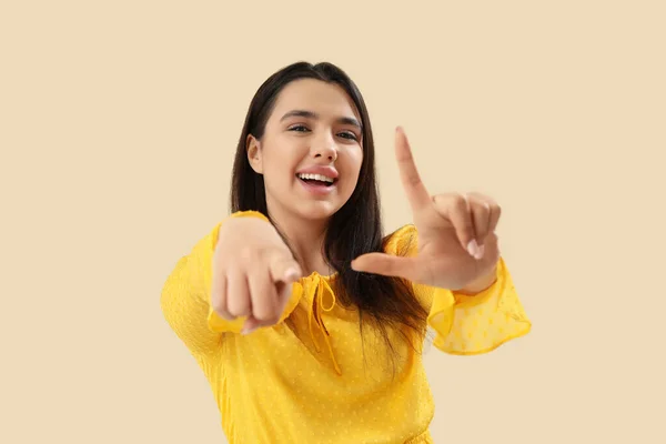 Young Woman Showing Loser Gesture Beige Background — Stock Photo, Image