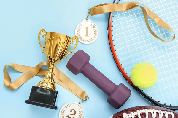 Gold Cup Prize Medals Sports Equipment Blue Background — Stock Photo, Image