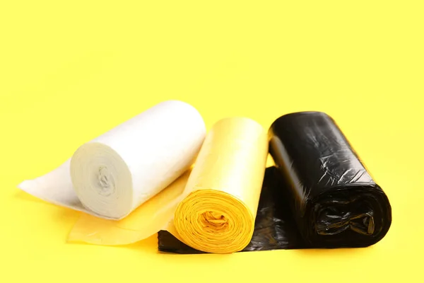 Different Rolls Garbage Bags Yellow Background — Stock Photo, Image