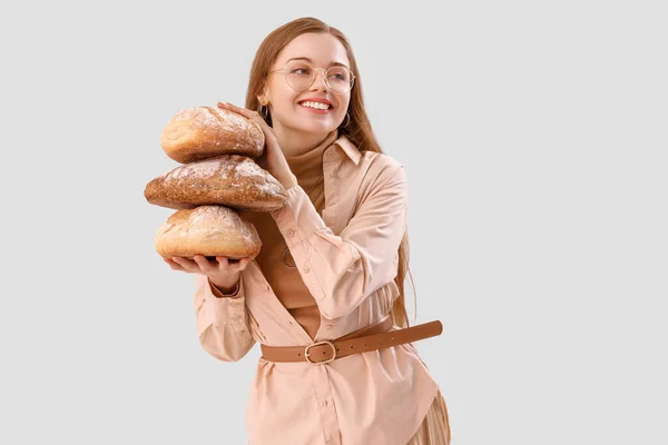 Young Woman Loaves Fresh Bread Light Background — Stock Photo, Image