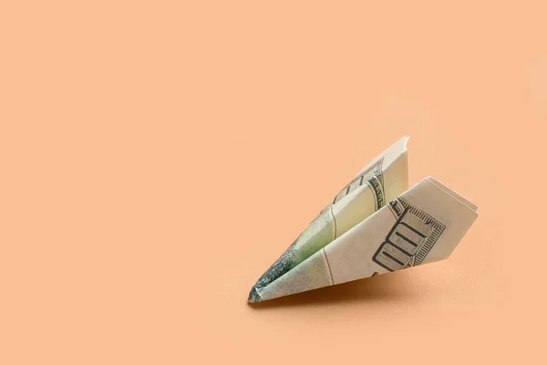 Origami Samolot Wykonany Banknotu Dolarowego Beżowym Tle — Zdjęcie stockowe