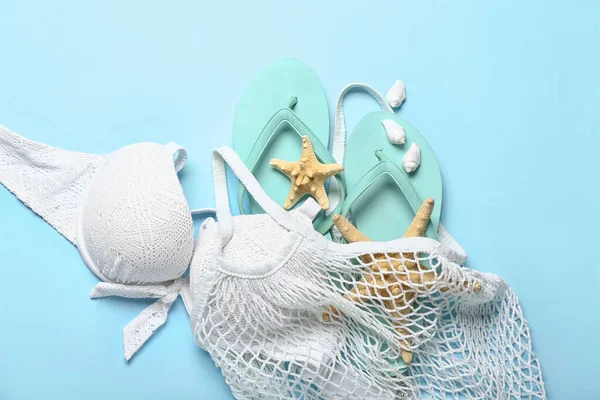 String Bag Flip Flops Swimsuit Starfishes Blue Background — Stock Photo, Image