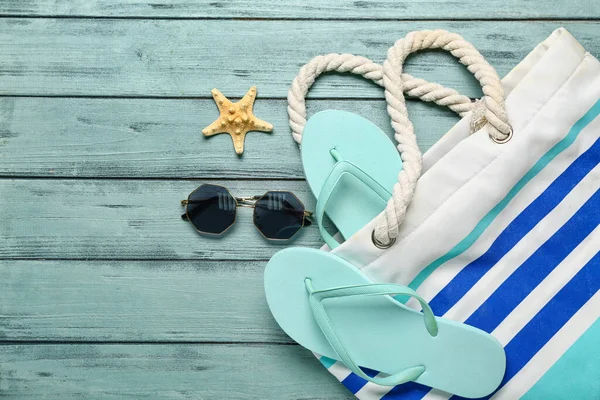 Flip Flops Bag Sunglasses Starfish Blue Wooden Background — Stock Photo, Image
